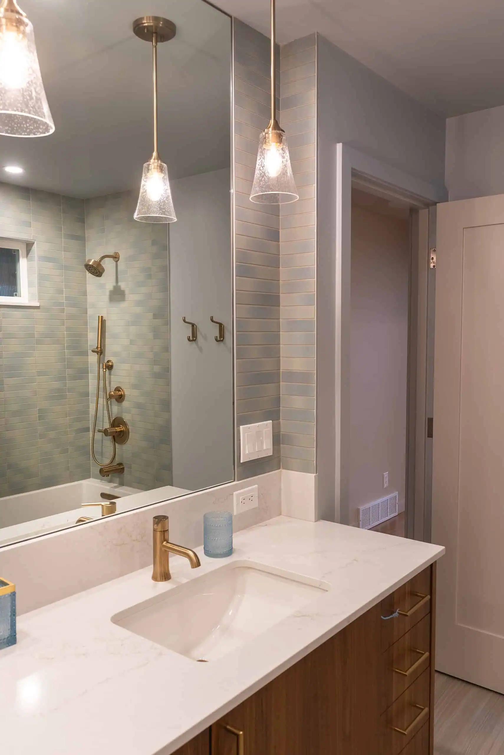 Completed View Ridge kids bath with walnut linen storage