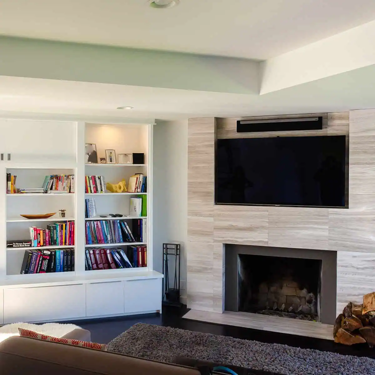 Custom fireplace surround with built-in shelving