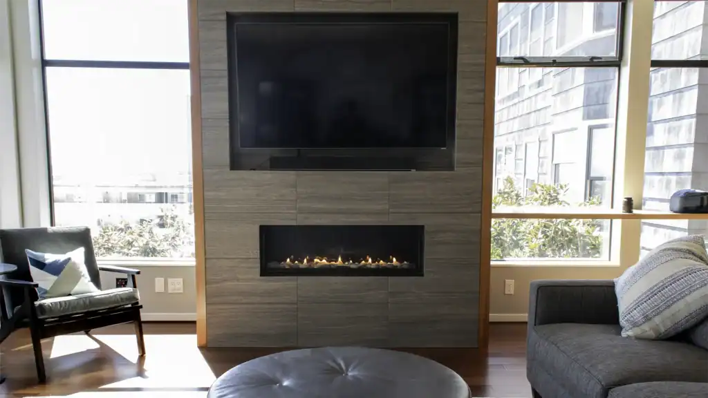Feature wall with tile fireplace surround and integrated media storage