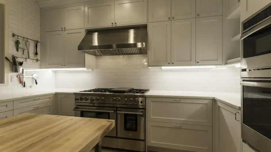 Blue Star professional range with commercial hood and subway tile