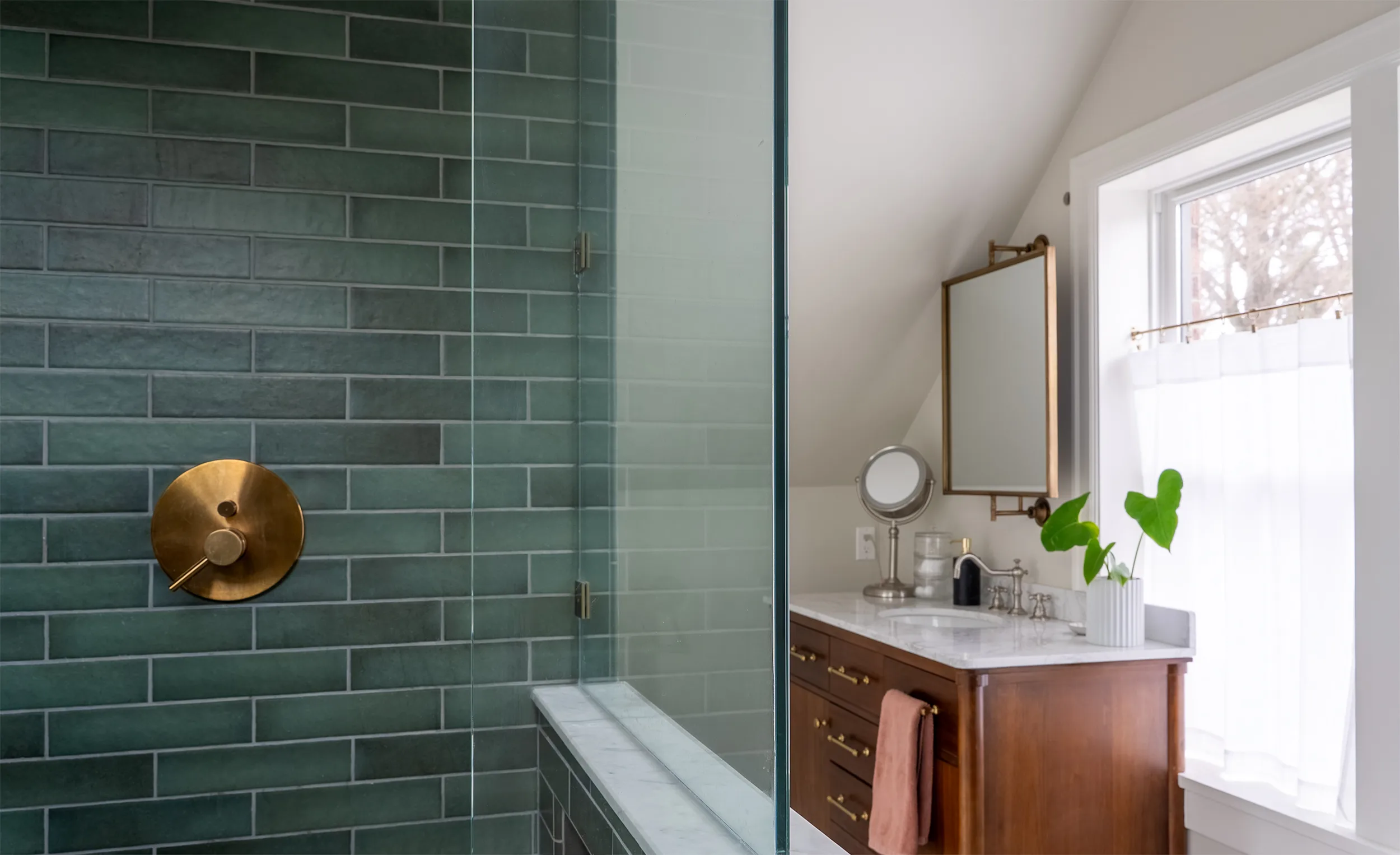 Maple Leaf master bathroom remodel with marble tile, heated floors, and brass fixtures