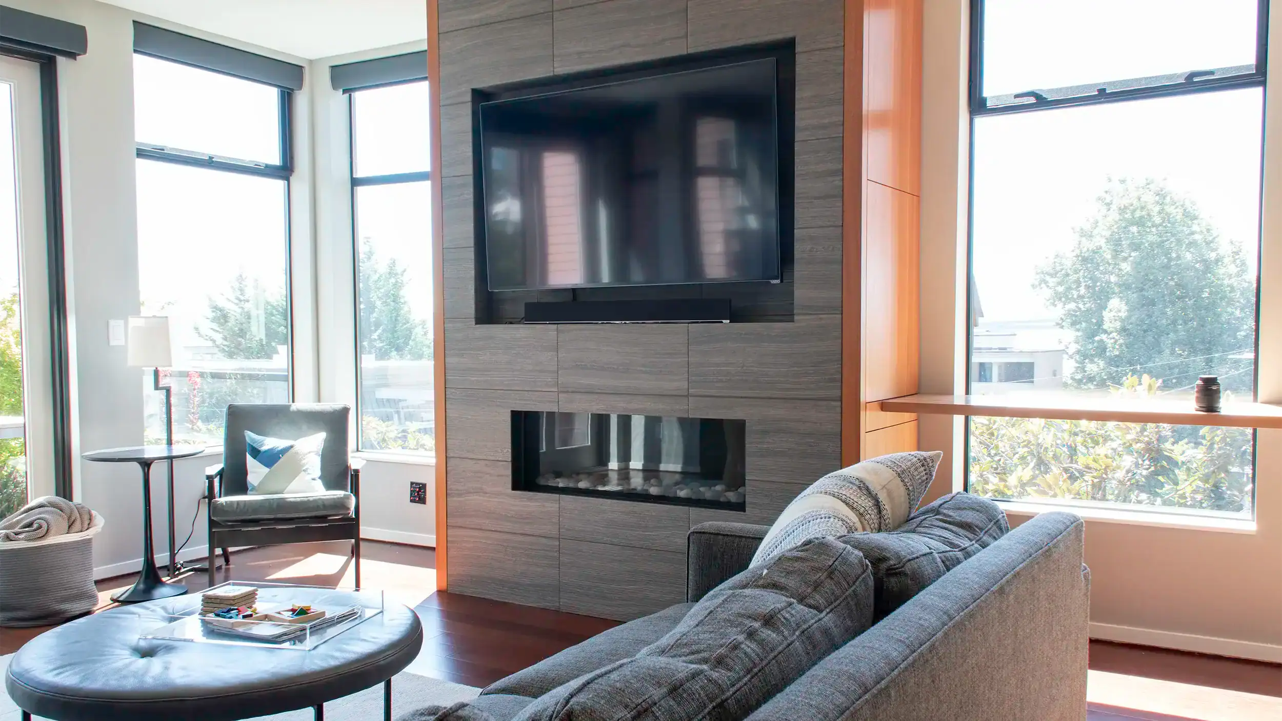 Custom built-in media wall with an inset TV and mahogany side storage