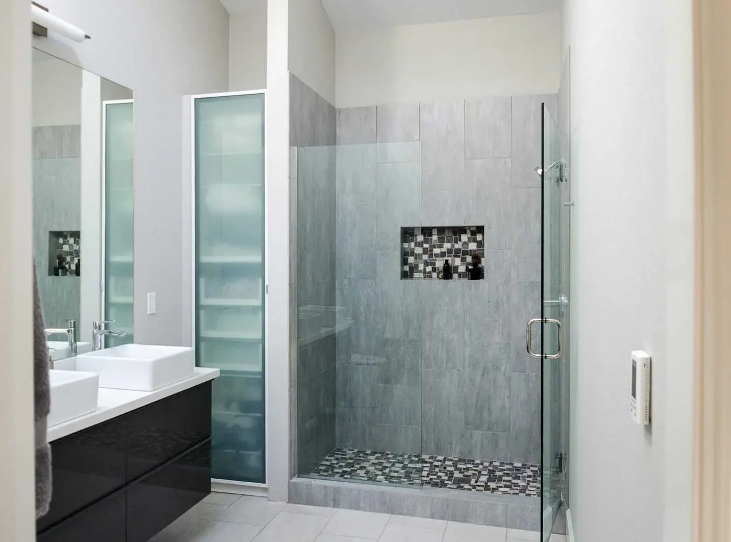 Tile walk-in shower with IKEA linen storage