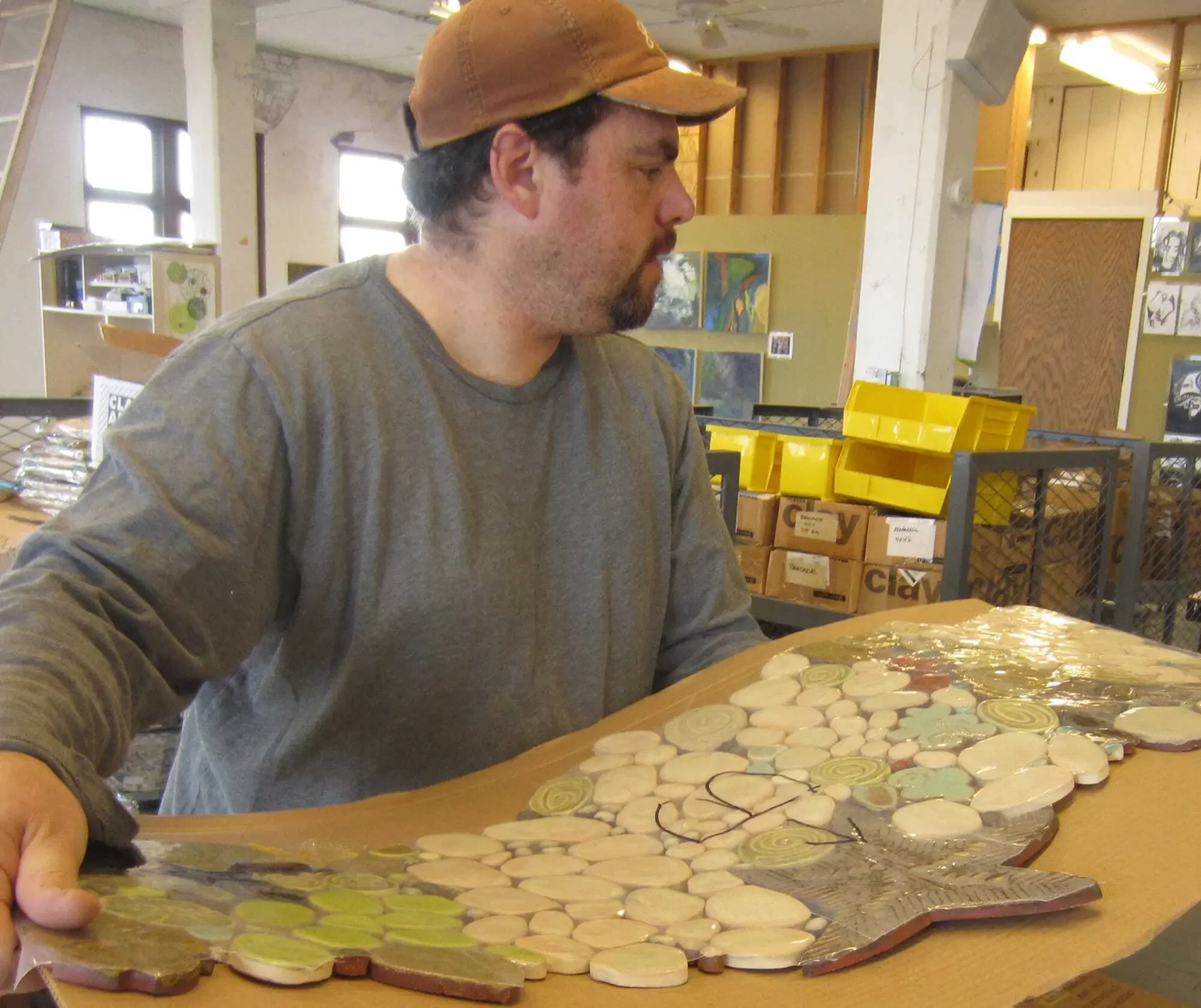 Tile mural sections are packed up for delivery