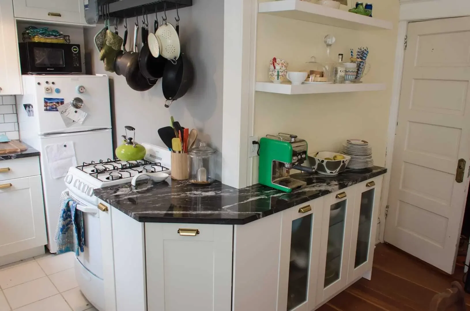 Cabinets wrap around wall for extended kitchen workspace