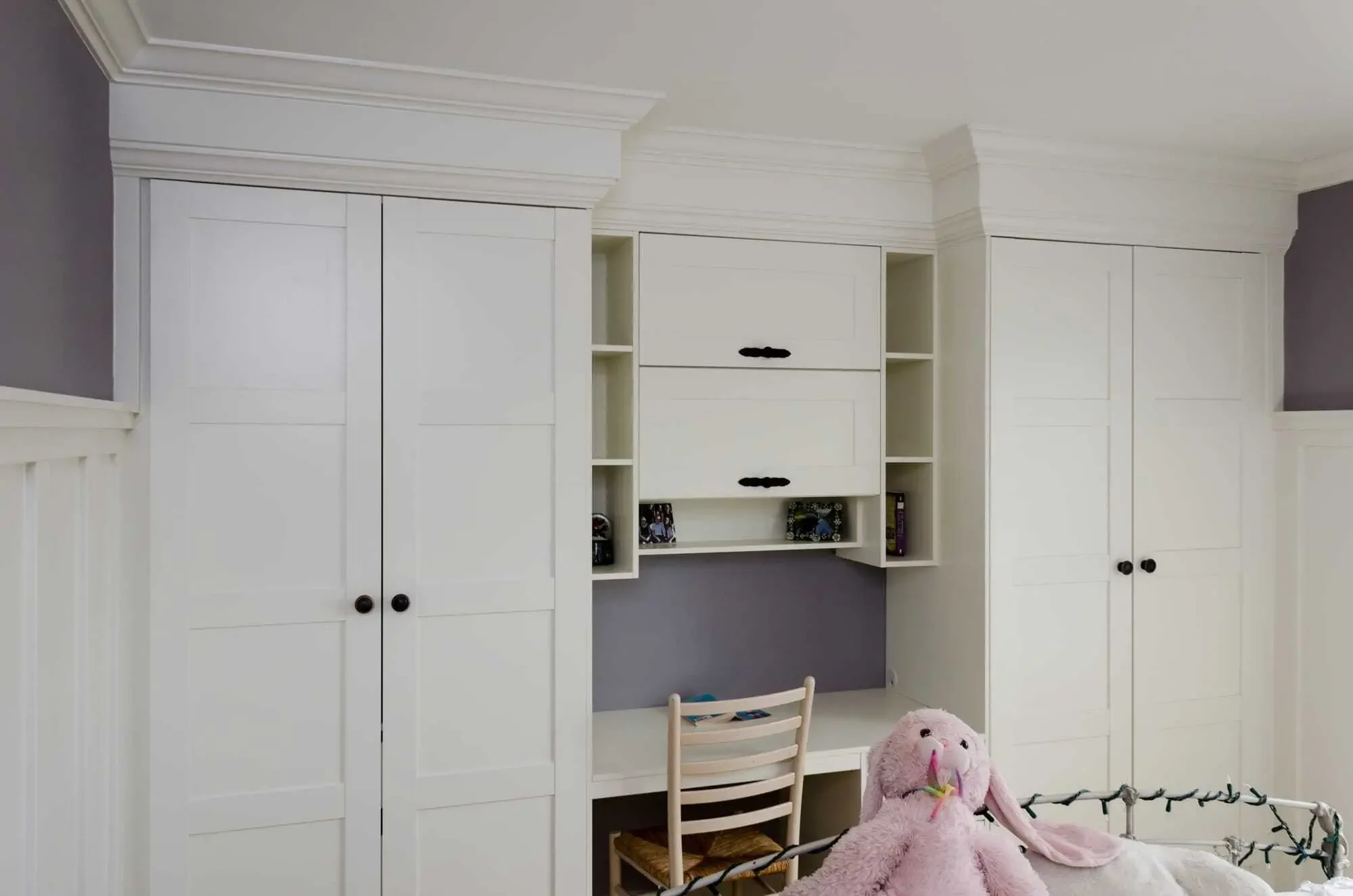 A combination wardrobe and study area using IKEA cabinets