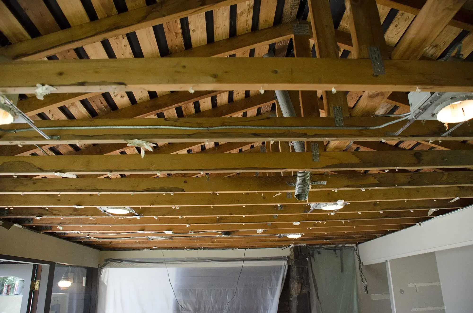 Popcorn ceiling removed, old ceiling trusses exposed