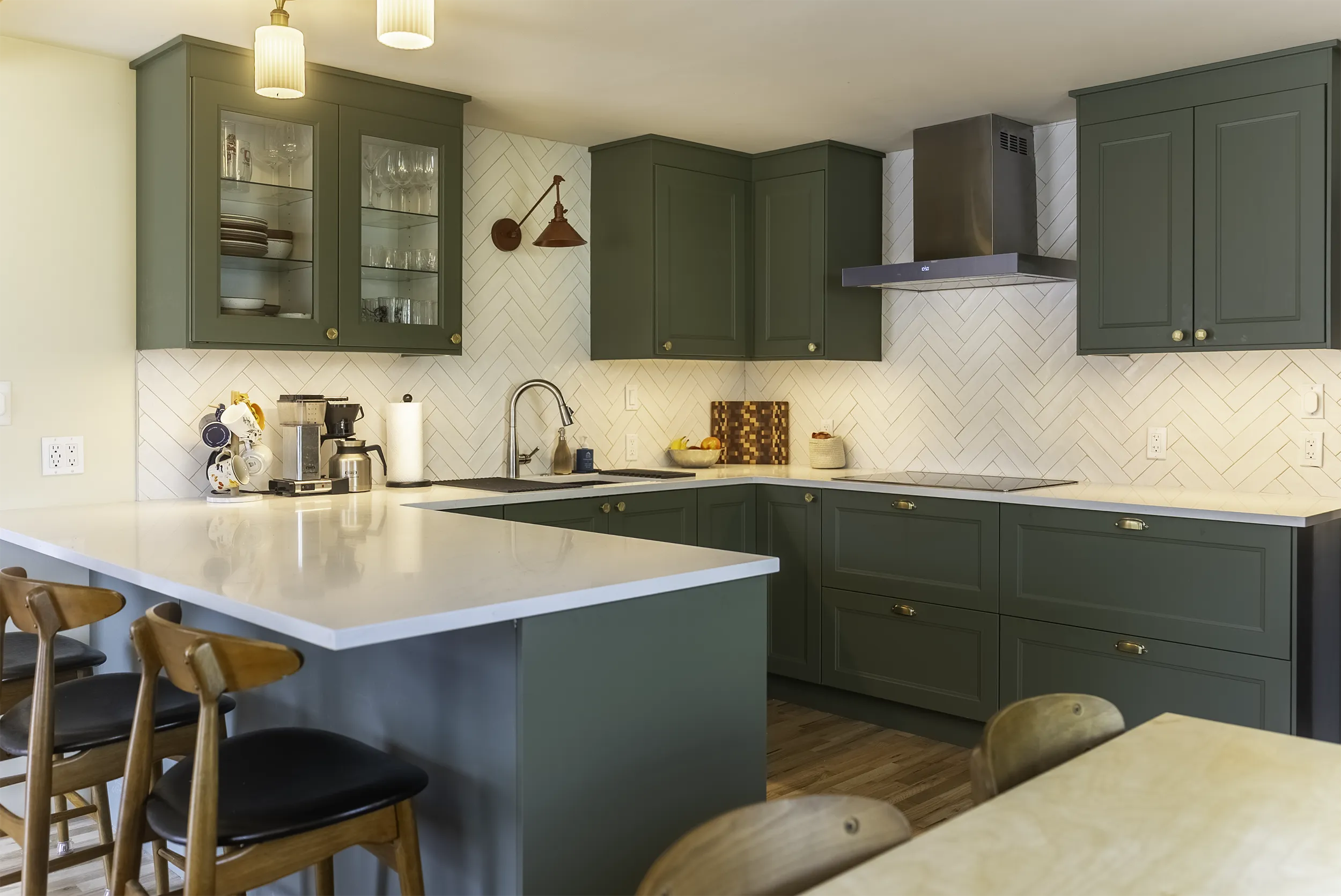West Seattle kitchen remodel with a green IKEA kitchen peninsula and bar seating