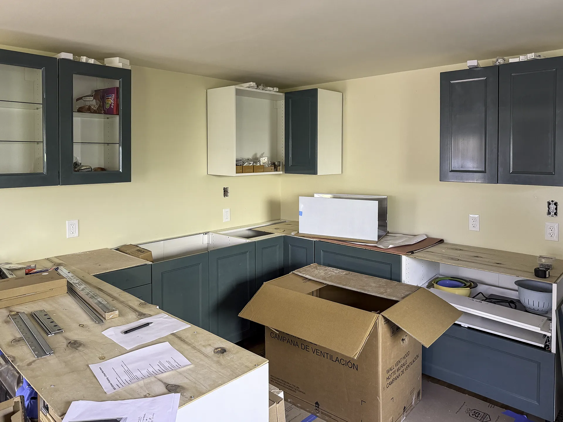 West Seattle IKEA kitchen installation in progress with green Sektion cabinets going in